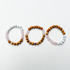 Three beaded bracelets on a white background