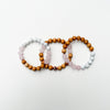 Three beaded bracelets on a white background